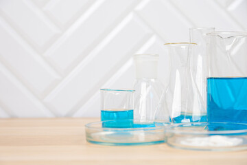 Laboratory glassware with test tubes. flasks, dropper, petri dishes, measuring cups and cylinders for scientific laboratories, laboratory equipment and analysis