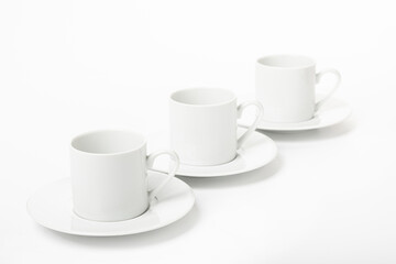 White porcelain cup and saucer for cappuccino and coffee isolated on a white background