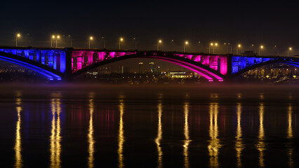 Night city lights, river, bridge