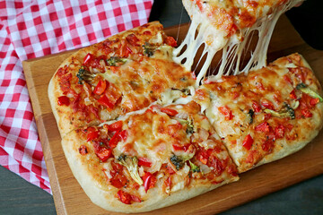 Slice of Fresh Baked Pizza Alla Pala with Mouthwatering Stretching Cheese Being Taken from...