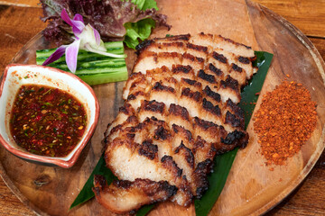 sliced pok neck got grilled and served with spicy dip-sauce.