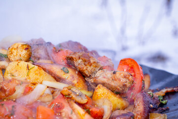 Cooking potatoes on a fire in winter.