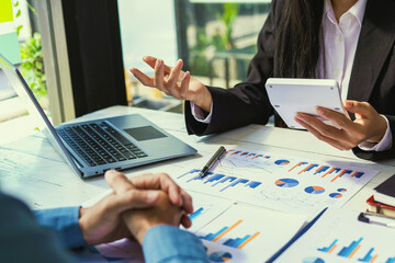 Business consultant concept, business woman holding a calculator consulting a business man who is in financial trouble.