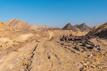 The impressive landscapes of Colas de Dragon in the desert of Tabernas, Almería province, Andalusia. Trekking in the desert, lifestyle