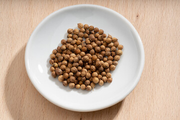 Detailed and large close up shot of coriander on a small plate