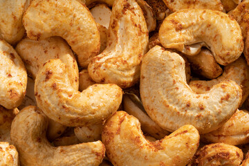 Detailed and large close up shot of roasted cashew.