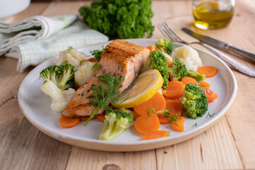 Low carb fish dish with pan fried salmon fillet and imperial vegetables