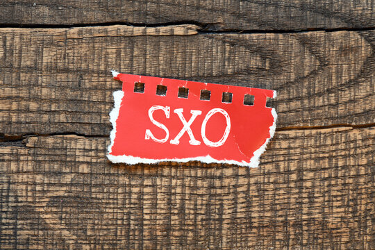 SXO (Search Experience Optimization) written on red red sheet of paper