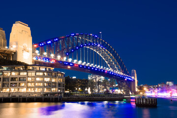 Sydney Harbour Bridge illuminating the night skies viewed from the Rocks on Australia Day  