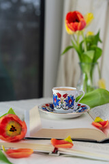 Cup of Turkish coffee and tulips