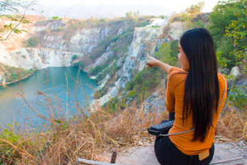 Beautiful asian girl exploring Canyon in Thailand