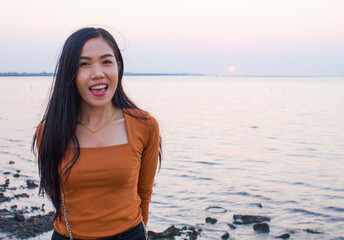 Happiness woman is enjoying serene ocean nature