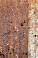 Broken old wavy iron sheet with heavy rust for texture background