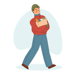 Young man walking with groceries. Winter time