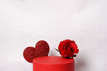 Valentine's red podium with heart and flower rose for product display, Valentine's day light...