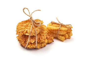 Fried chicken strips in breadcrumbs with french fries, isolated on white background.