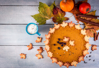 Homemade pumpkin pie with cappuccino, top view