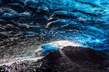 An icy river carries melt water through an ice cave in the glacier. Breioarmerkurjokull, southeast Iceland