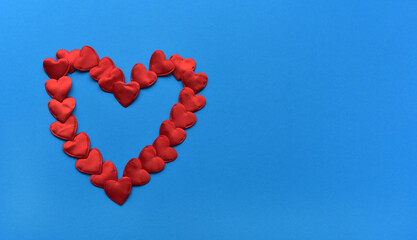 St. Valentine's Day. Red hearts on a blue background