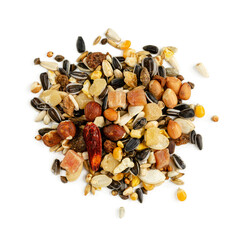 Isolated heap of parrot fodder of dried fruits, nuts and seed mix. Healthy food for pets. Top view