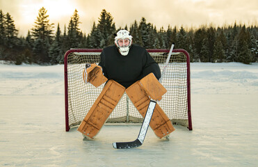 Hockey goalie outside on winter season with beautiful equipment