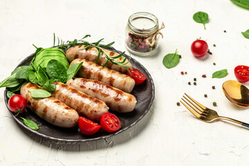 Grilled sausage with spinach, avocado and cherry tomato. hot barbecue dish. Keto paleo diet menu. Healthy fats, clean eating for weight loss