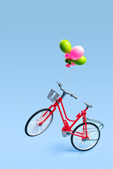 Fototapeta na wymiar Flying bicycle with several balloons tied to the handlebars