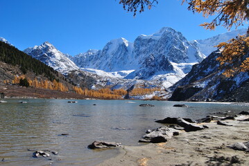 Fototapeta na wymiar Mountain lake in autumn. Karakol lakes in Altai. The Altai Republic is the North-Chuisky Ridge. Autumn in Altai.