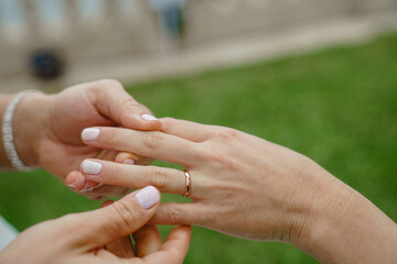 Young lesbian couple Gay wedding Same-sex marriage Cropped shot of two unrecognizable women exchanging rings on their wedding day 