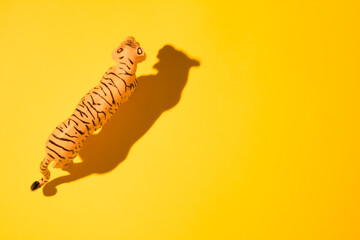 Tiger on yellow background. Lunar New Year, 2022 The Year of the Water Tiger.  Happy Chinese New Year and good luck!