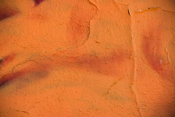 closeup of orange painting on the wall texture