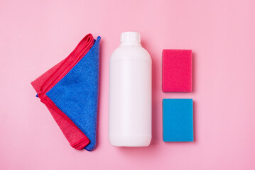 White Bottle With Cleaning Napkin on Pink Background Eco Cleaning Concept Surface with Absorbent Tissue and Bottle of Detergen