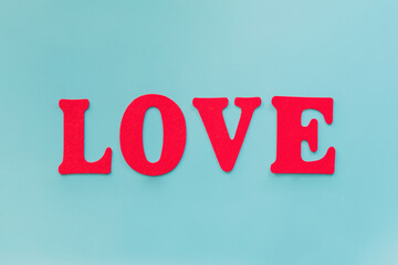 Love text on blue background with copy space
