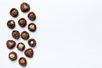 Different kinds of chocolates on colored table close-up. Top View and Flat Lay with copy space