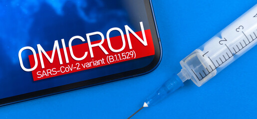 Concept of vaccination for new coronavirus covid-19 omicron B.1.1.529 variant. Medical syringe...