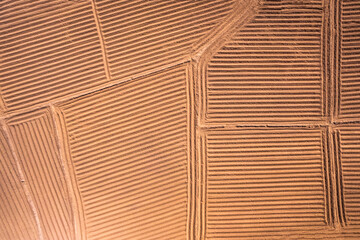 Fototapeta premium Agricultural soil groove, land spot field preparing for cultivation in farmland at countryside