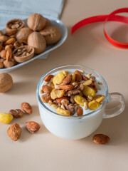The cup of yogurt was sprinkled with nuts