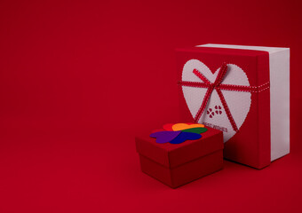 Gift boxes of red color in the shape of a square on a red background