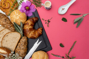 Various types of bread on a red background