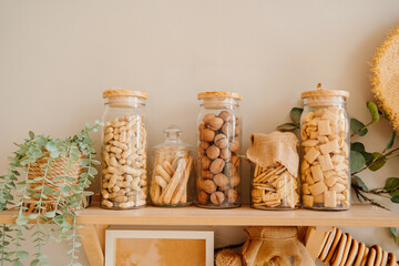 organization of storage on shelves in the kitchen is made of wood.