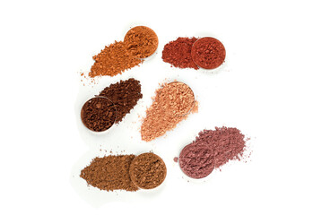 Eyeshadow crushed palette, colorful eye shadow powder isolated on a white background.
