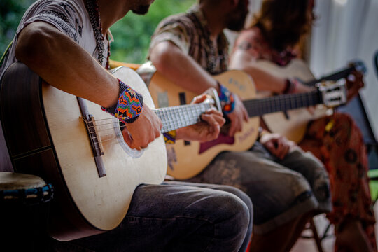 Sao Paulo, SP, Brazil - December 16 2021: Caucasian people sitting, playing guitar details