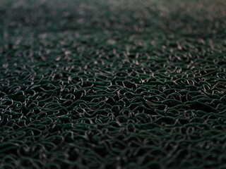 Close-up on green carpet with intricate texture