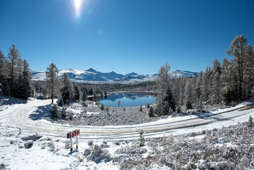 Lake in the mountains in winter. Lake Kidel. Altai.