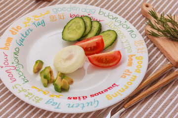 Poached egg, avocado, tomatoes on a plate, for quick and healthy breakfast, snack. Good dose of energy