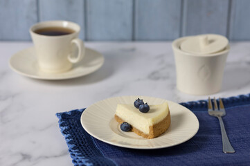 Classic cheesecake with blueberries at home. Selective focus.