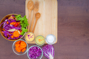 Fototapeta na wymiar Fruit salad on a cutting board on a wooden background,