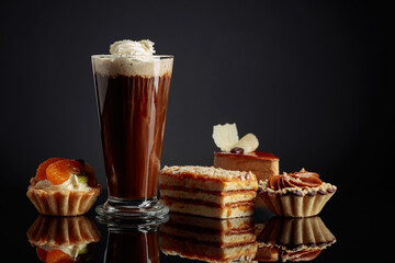 Coffee drink with whipped cream and cakes.