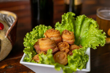 Delicious Food Contemporary Classic Dish Plate Menu Lunch Dinner Chicken BBQ Pork Sausage Bacon Regional Native Dessert on a WoodenTable