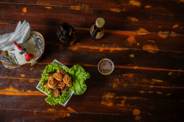 Delicious Food Contemporary Classic Dish Plate Menu Lunch Dinner Chicken BBQ Pork Sausage Bacon Regional Native Dessert on a WoodenTable